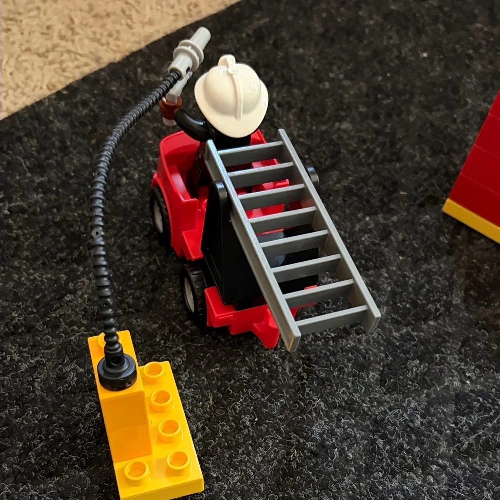Lego Duplo Fire Truck With Firefighter Figure with fire hydrant and flame pieces